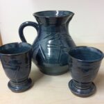 pottery pitcher and goblets